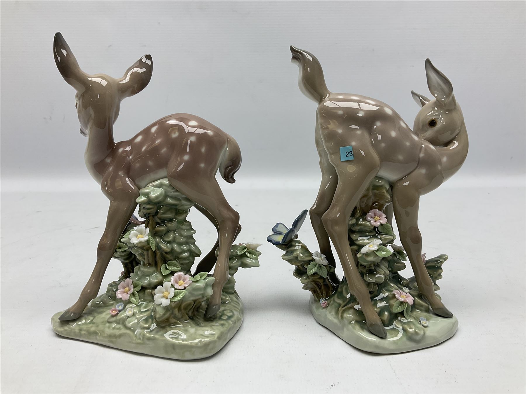 Two Lladro deer figures, comprising A Fawn and Friend no 5674 and Hi There no 5672, both with original boxes, largest example H14.5cm