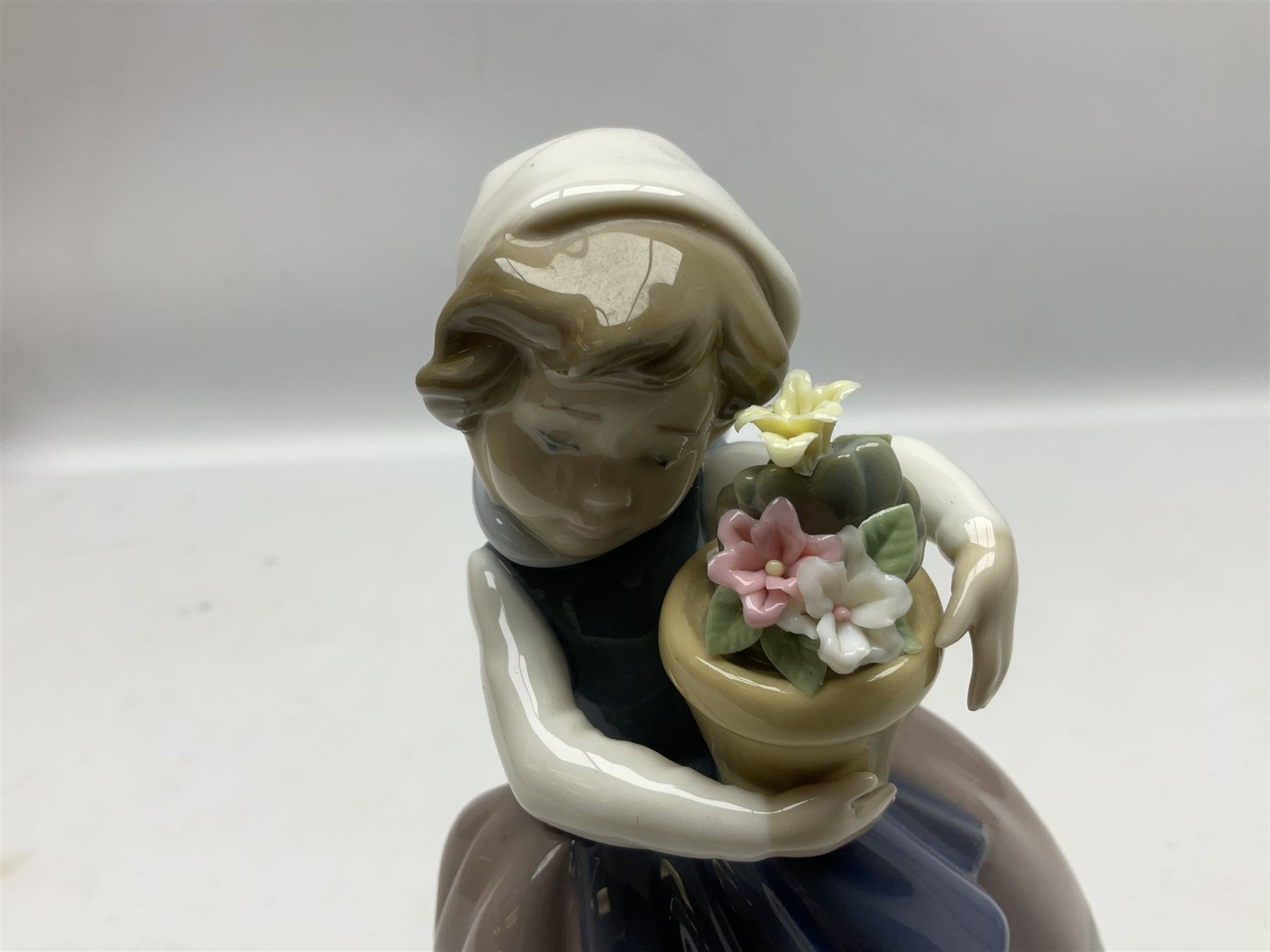 Three Lladro Flower Girls figures, comprising Sweet Scent no 5221, Pretty Pickings no 5222 and Spring is Here no 5223, largest example H18cm 