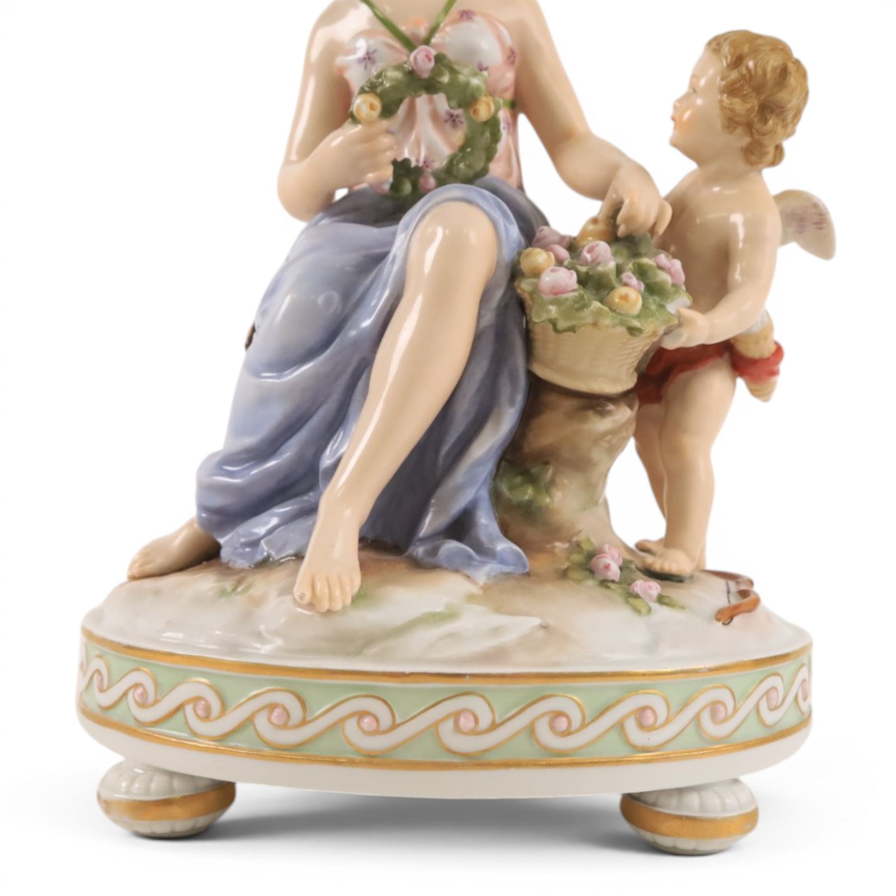 Karl Ens of Volkstedt figure group, modelled as a woman and cherub in a garden, with printed mark beneath, together with another figure modelled as a muse 