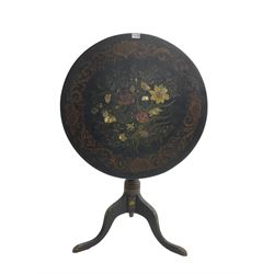 19th century black lacquered pedestal table, circular tilt-top with mother of pearl inlay amongst flower head and floral painted decoration and a scrolling foliate border, raised on ring turned column with cabriole tripod base 
