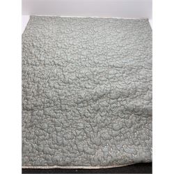 A large light blue quilt embroidered in silver thread with flowers, approximately 260cm x 245cm.