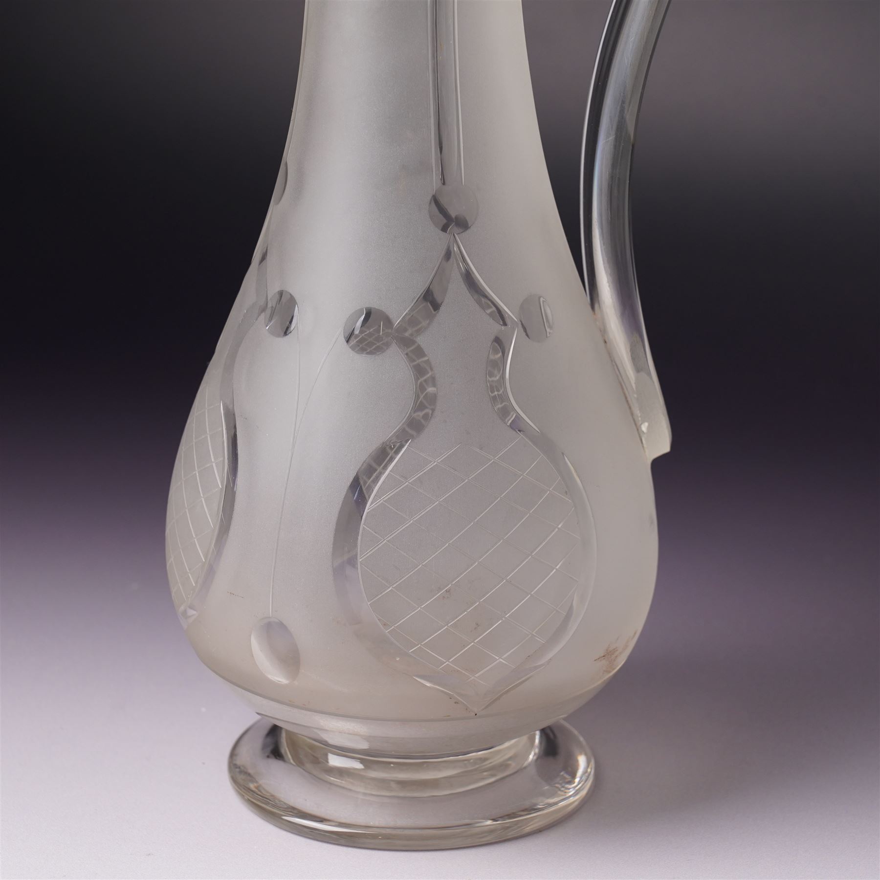 Victorian opaque glass ewer with clear cut decoration and clear glass handle H28cm and an etched glass claret jug with silver plated cover and handle H31cm
