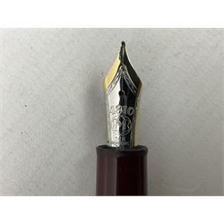 Mont Blanc Meisterstuck fountain pen, the burgundy lacquer body with gilt band detail, signed 'Montblanc-Meisterstuck', with 14kt gold nib, serial number EK1120925
