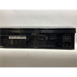 Sony PlayStation 3 60GB console with one PS3 controller, two PS2 controllers, BD remote control, PSP handheld gaming console with case, GAMEware PSP essentials pack, and a selection of PS2, PS3 and PSP games in original cases with instruction booklets 