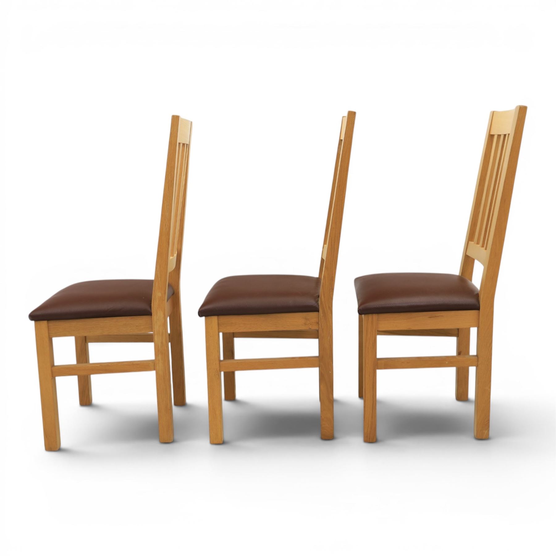 Modern solid oak dining table with set six chairs, chairs with brown leatherette seat