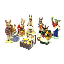 A group of seven Royal Doulton Bunnykins figures, comprising Father, Mother & Victorian Bunnykins DB68, Santa Bunnykins DB17, Uncle Sam Bunnykins DB50, Bunnykins Sleepytime DB15, Old Baloon Seller Bunnykins DB217, Statue of Liberty Bunnykins DB198, and Ice Cream Bunnykins DB82.