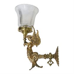 Pair of Victorian style wall sconces, each modelled as a caryatid supporting a single light fitting in one raised arm, with tapering and fluted clear glass shade, approximately H31cm D21cm