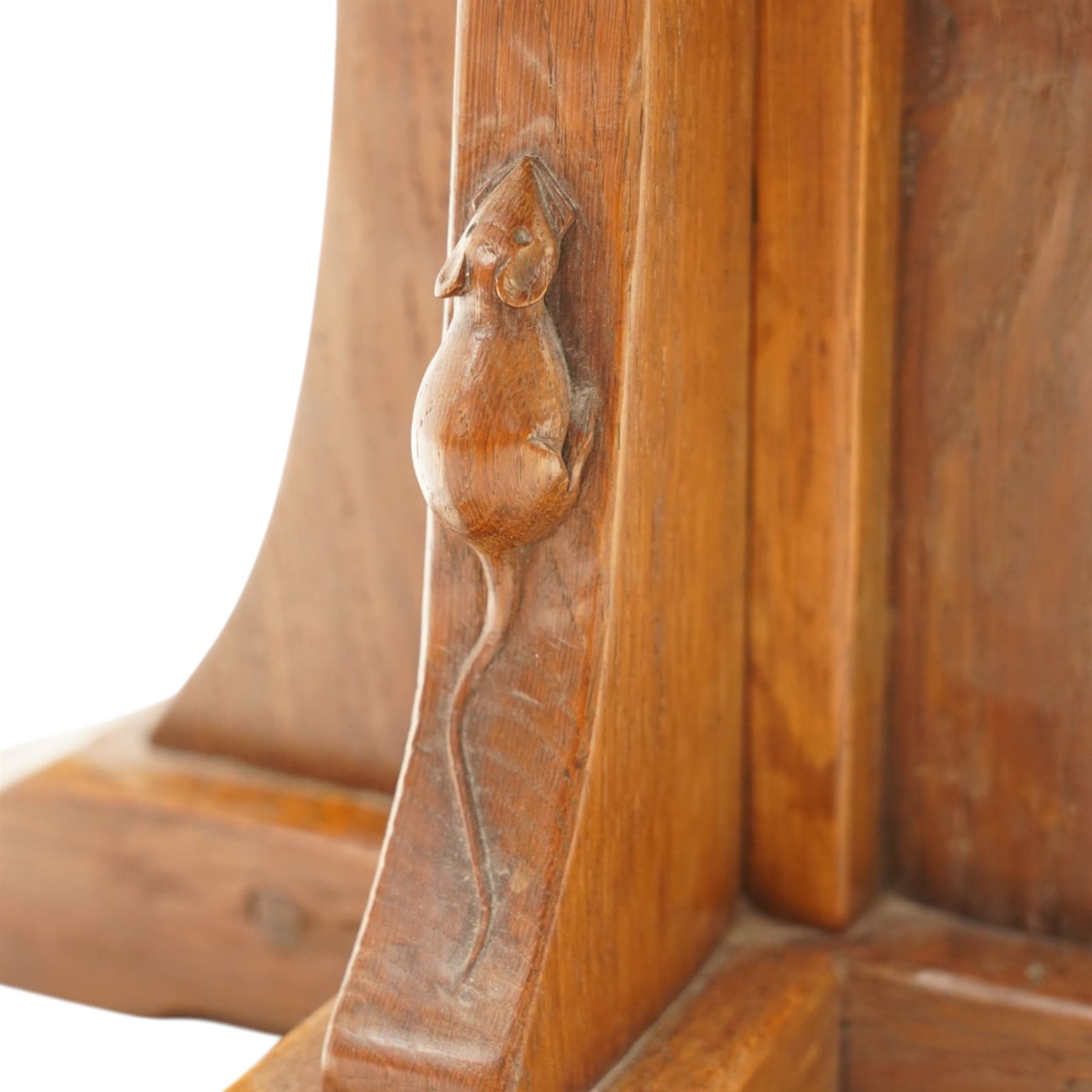 Mouseman - mid-20th century adzed oak coffee table of small proportions, the octagonal  adzed top raised on cruciform base and sledge feet, carved with mouse signature, by the workshop of Robert Thompson of Kilburn 