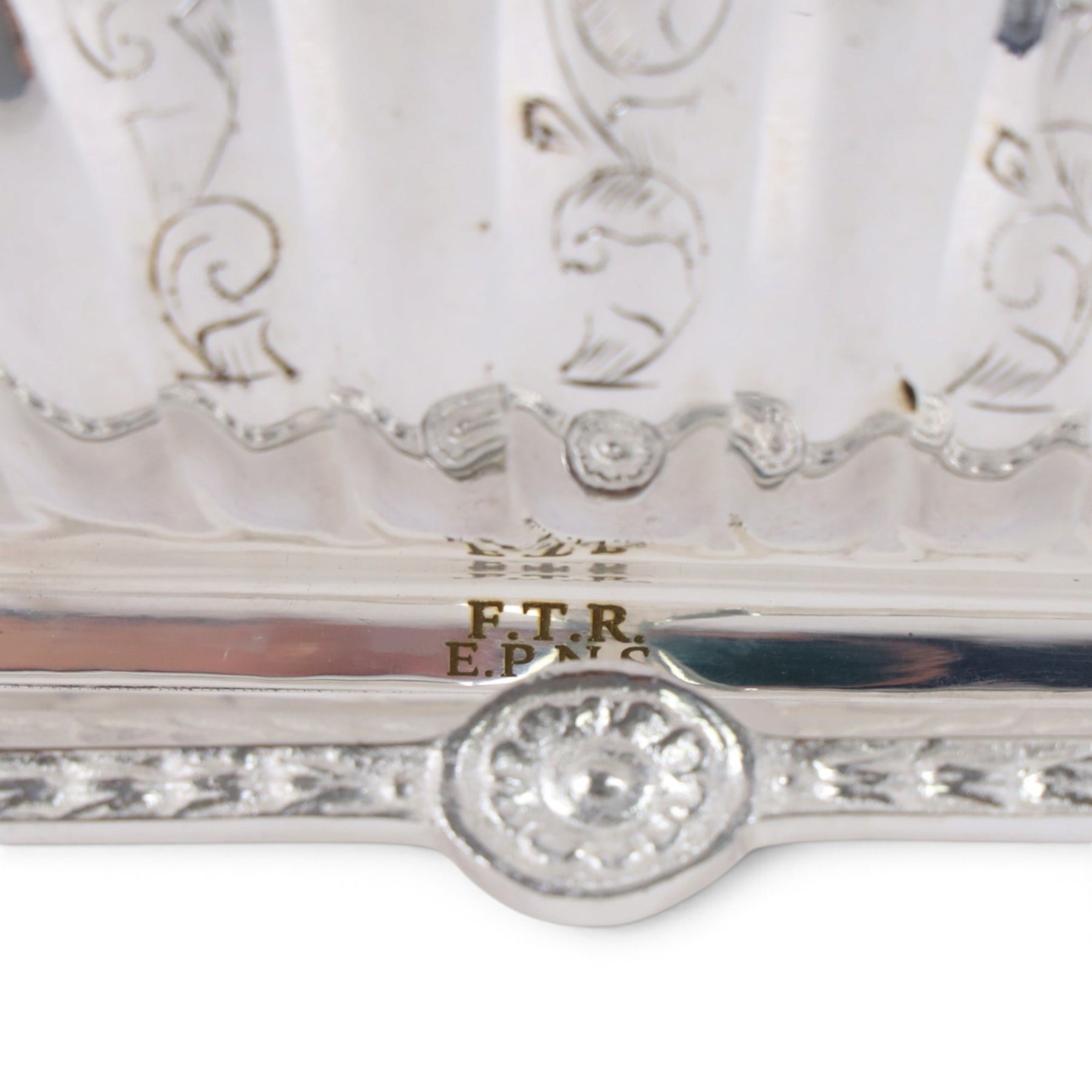Silver-plated Victorian style biscuit box, in a shell form with engraved leaf detailing, upon scroll feet, H24cm