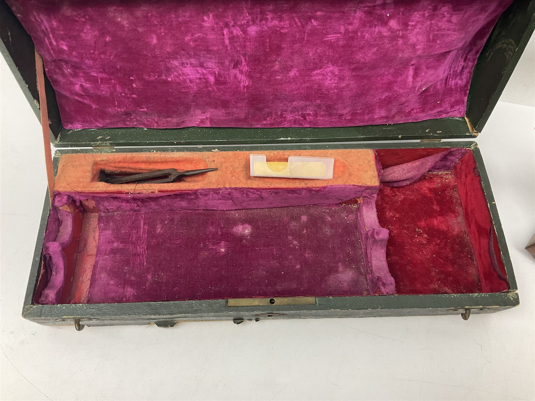 Early 20th century Hawkes and Son simple system hardwood clarinet serial no.1HM257102; cased; and a Swiss Maelzel BS Dulcet metronome of typical pyramid form (2)