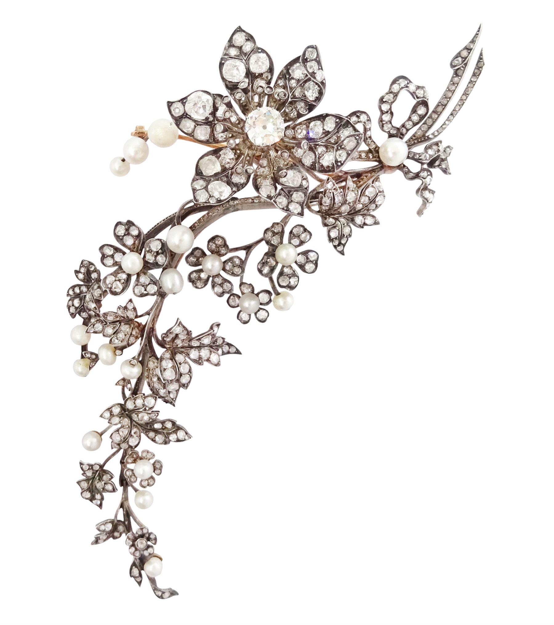 19th century gold and silver diamond and pearl en tremblant detachable brooch, the flower tremblant with a principal old cut diamond of approx 1.90 carat, the petals and stamen set with old cut and rose cut diamonds, total diamond weight approx 9.10 carat, to a foliate spray set set with further rose cut diamond and white / pink / cream pearls and ribbon tie