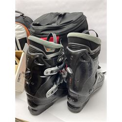 Three sets of Salomon ski boots (two as new), together with associated clamps