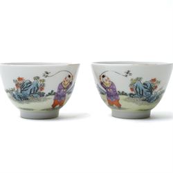 Pair of Yongzheng style tea bowls, decorated with boys playing with birds and butterflies, apocryphal six character mark within blue square to base, H4.5cm
