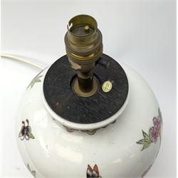 A ceramic table lamp, of ovoid form decorated in the Oriental style with blossoming flowers and butterflies, including fixture H34cm. 