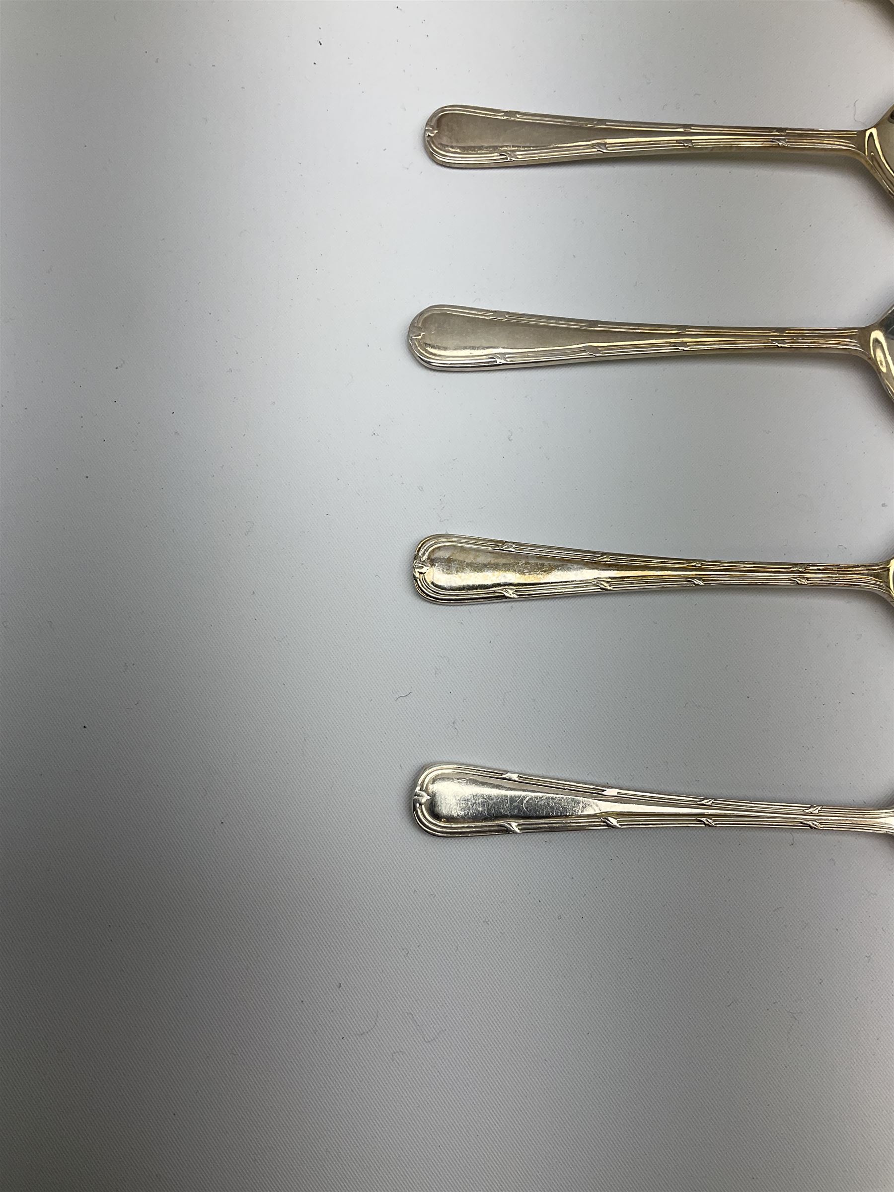 Oneida Community silver plated cutlery in the Mansion House pattern, comprising fithteen teaspoons, twelve soup spoons and six serving spoons together with matched cutlery, compromising fourteen forks, twentythree knives, twelve spoons, ten dessert spoons, one teaspoons,and a selection of other cutlery. 