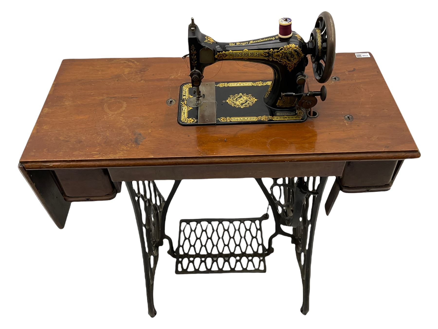 Singer - walnut and cast iron treadle sewing machine
