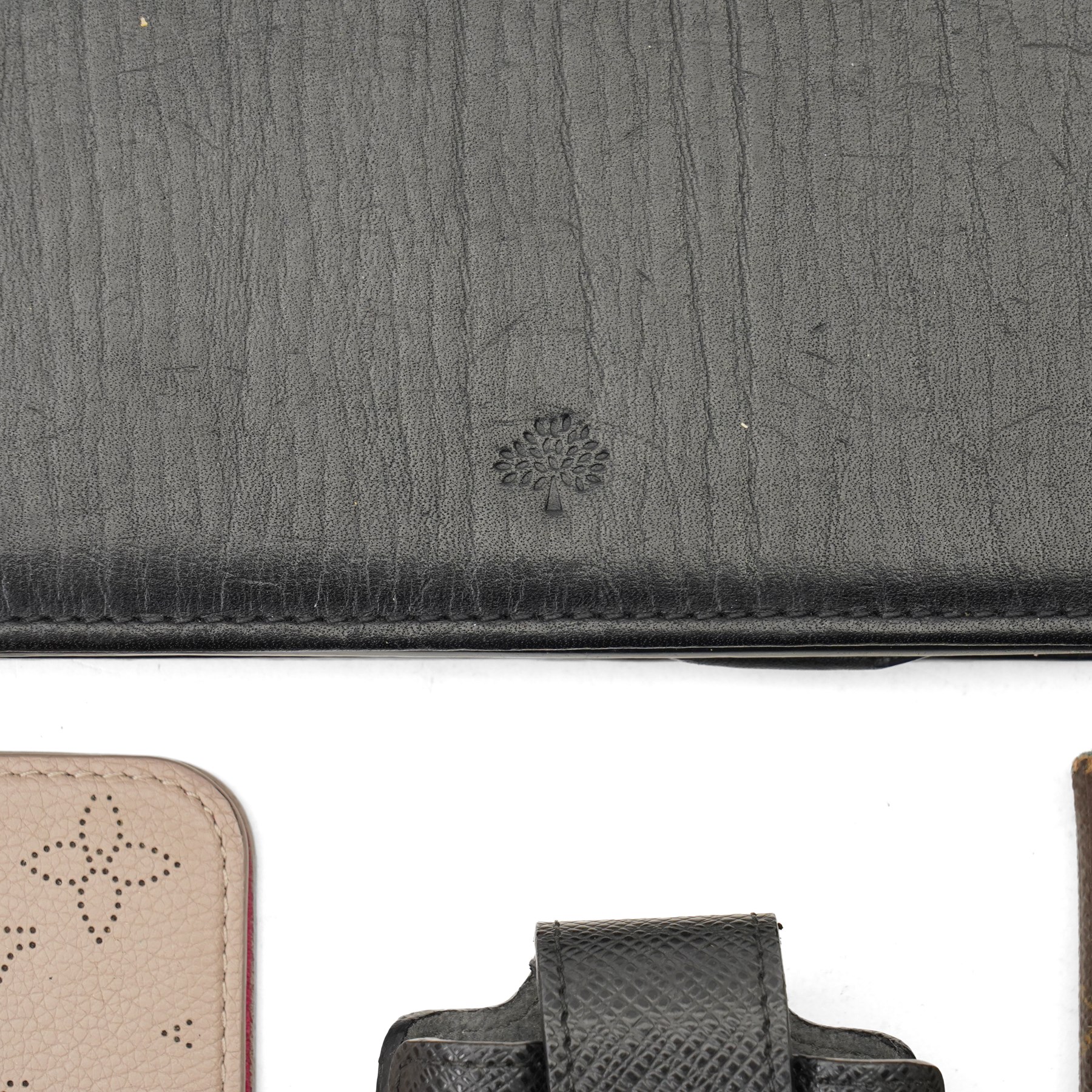 Louis Vuitton, Prada, Mulberry, Saint Laurent and others - collection of designer leather phone cases and pouches, in various colours and designs, together with a Mulberry leather iPad case (12)