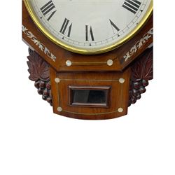American - late 19th century 8-day mahogany drop dial wall clock, with a hexagonal dial bezel inlaid with mother of pearl, pendulum box with a rectangular viewing glass flanked by carved representations of grape vines, with a painted dial with roman numerals, minute track and steel spade hands within a spun brass bezel, eight day striking movement striking the hours on a gong.   With pendulum & key.