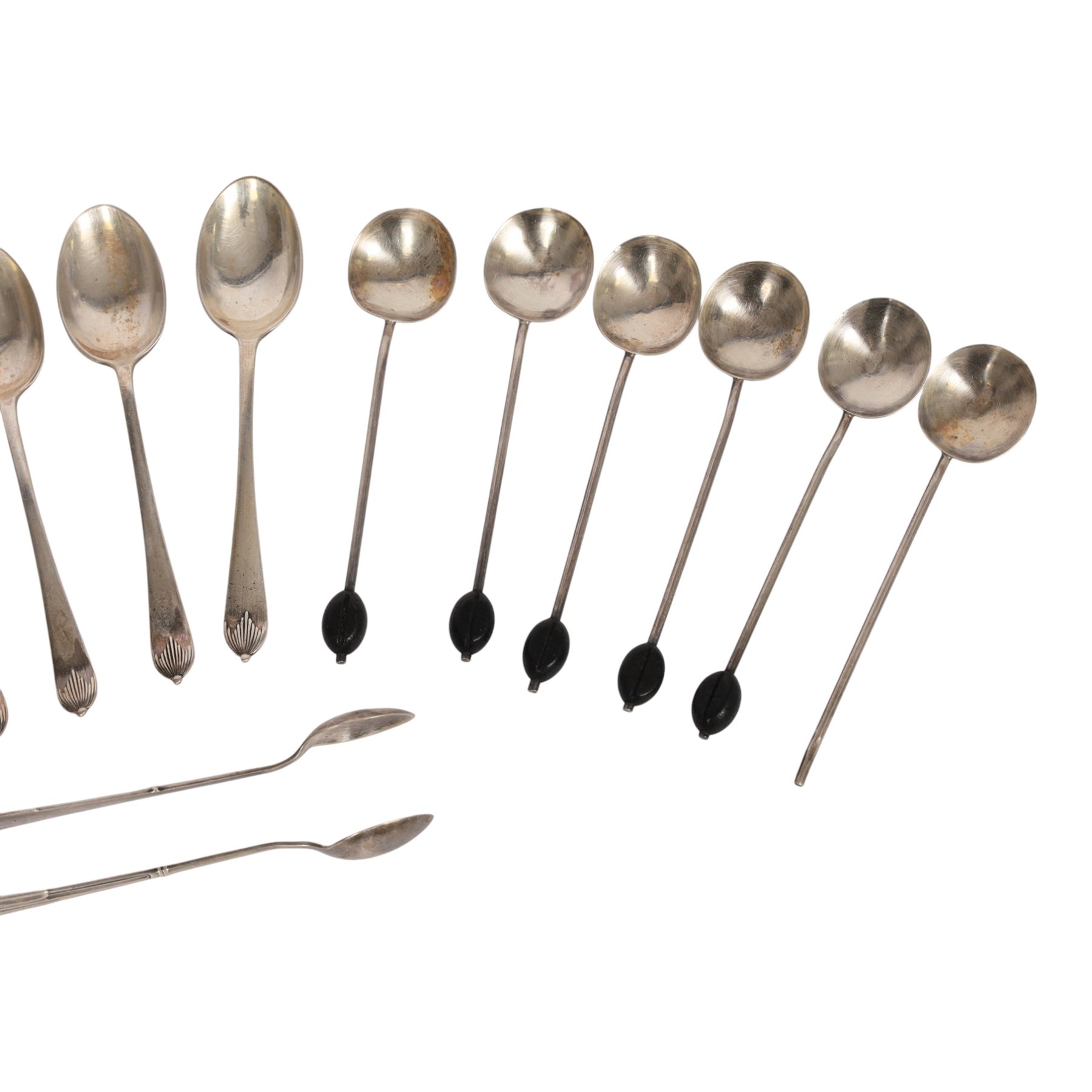 Collection of silver cutlery, including sugar tongs, coffee bean spoons, teaspoons, etc, all hallmarked