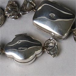 Four novelty silver pill boxes, in the form of wrapped sweets, all hallmarked, largest W6cm