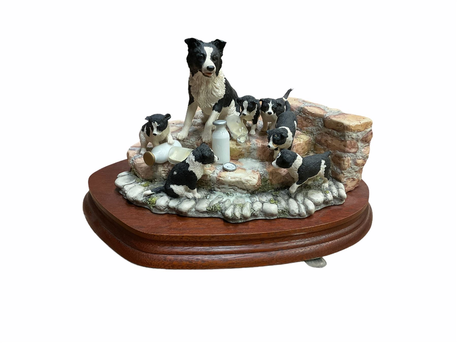Border fine arts figure, Border collie, model no MT07, by M Turner H22cm, along with Border fine arts figure Spilt milk, model number JH99, by Ray Ayres H15cm.