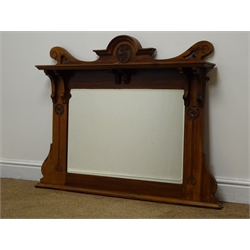 Edwardian Art Nouveau walnut overmantle mirror with top shelf and carved stylised motifs, W105cm, H86cm  