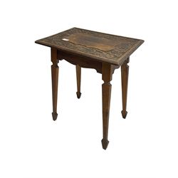 Arts & Crafts period oak occasional table, rectangular moulded top carved with trailing foliage and flower heads, on tapering supports with spade feet