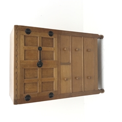 'Mouseman' panelled oak tallboy, panels and frame adzed, double cupboard above two short and two long drawers, by Robert Thompson of Kilburn, W85cm, H124cm, D49cm