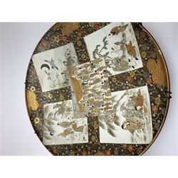 Pair of Japanese Meiji period (1868-1912) wall chargers, each painted with five panels, two depicting water birds in flight, the others depicting various figural scenes including geisha and elders, set against a ground painted with prunus blossom, each with character mark verso, D45.5cm