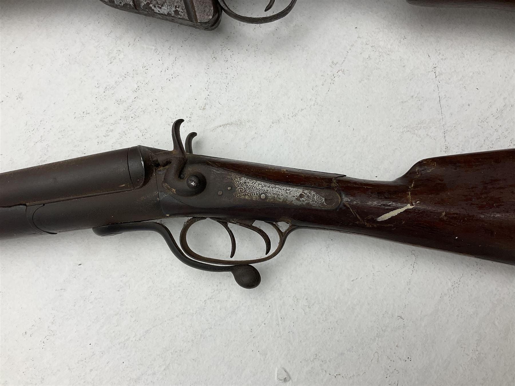 WW1 Lee Enfield SMLE .303 bolt action rifle with 63.5cm barrel and magazine; No.20934; L112cm overall; home deactivated by welding down bolt and end of barrel so requires re-deactivation to modern standards; and 19th century 12-bore double barrel hammer shotgun with 65cm cut-down barrels, non-rebounding hammers and under-lever opening, the lock-plate indistinctly inscribed G.T. Bartrant(?) L75cm overall; home deactivated by welding both barrels closed at breech so requires re-deactivation to modern standards (2) RFD ONLY 