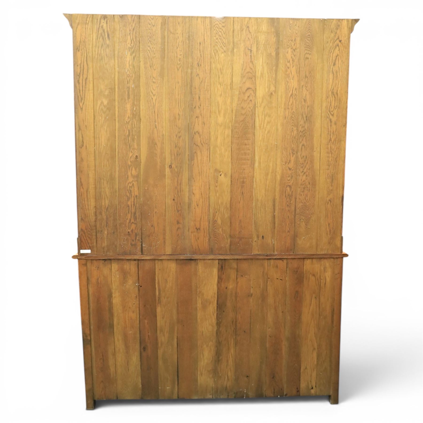 Traditional oak dresser with plate rack in the manner of Titchmarsh & Goodwin, plate rack with projecting cornice and shaped and pierced frieze, tongue and groove back three racks, over seven small spice drawers, the lower section with three short drawers, central bank three of drawers, fielded panelled sides and cupboard doors, raised on stile supports