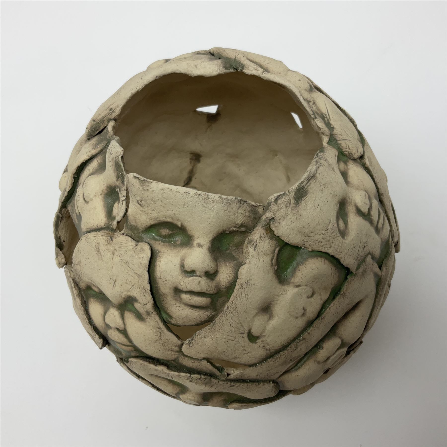 Studio pottery bowl, decorated with faces and a green glaze finish, H18cm 