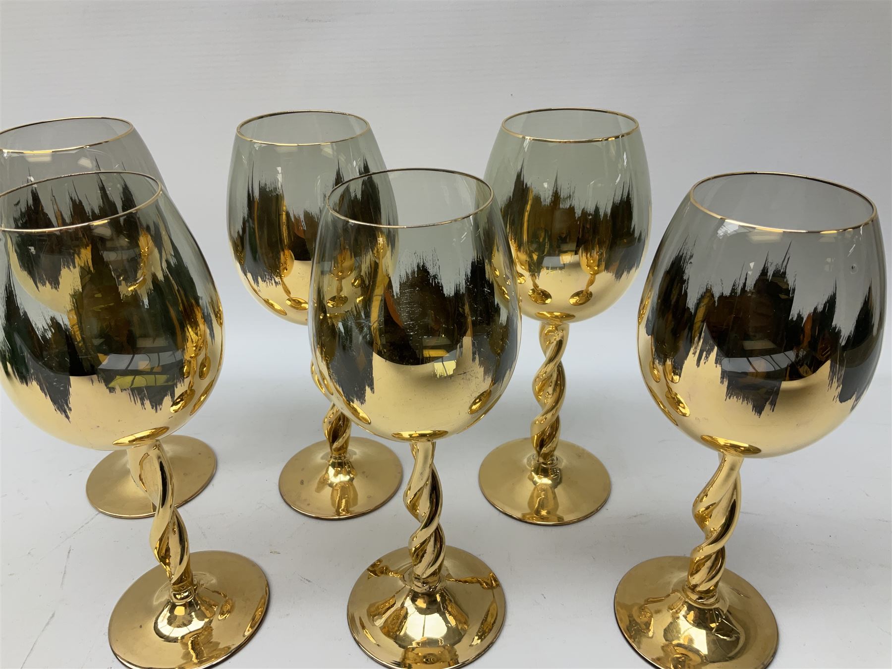 Set of six Art Deco style green glass sundae dishes, H9cm along with set of six Bohemian style glasses with twisted gilt stems