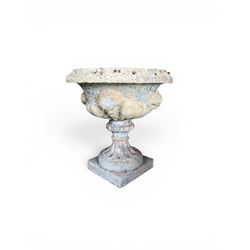 19th century terracotta campana shape urn planter, egg-and-dart moulded rim over a cherub-...
