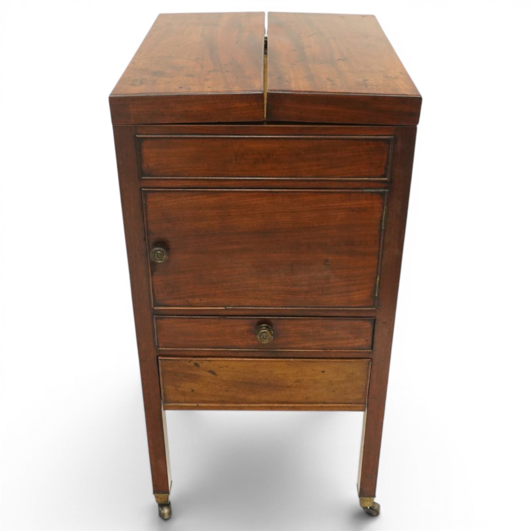 George III mahogany gentleman's washstand, rectangular double-hinged top enclosing fitted interior, over pot cupboard and two cock-beaded drawers, on square supports with castors