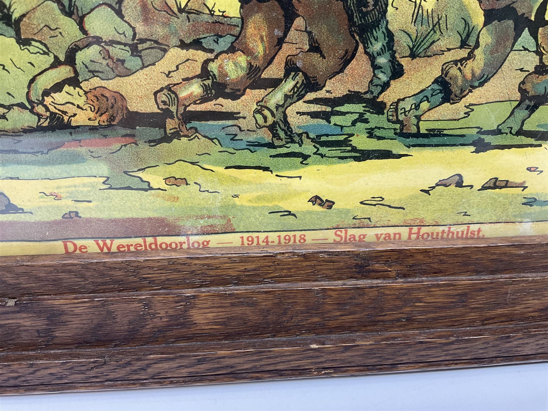 WW1 chromolithograph print of a battle scene with French and German soldiers in a wood, entitled 'De Wereldoorlog 1914-18 Slag Van Houthulst' 35 x 49cm, oak frame; and a framed WW1 regimental testimonial to 49744 Pte. E. Jagger KOYLI, gilt frame (2)