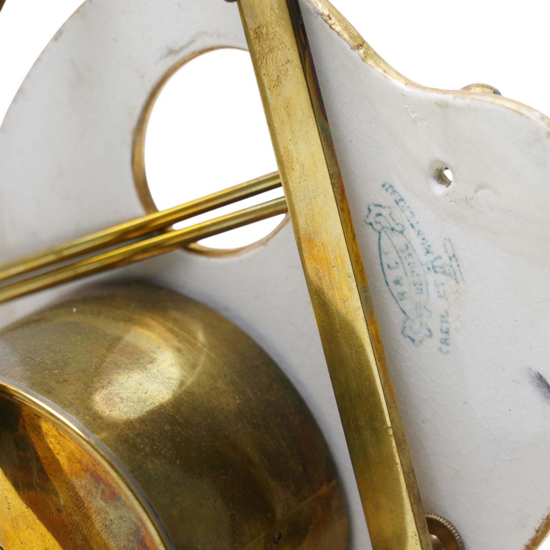 Late 19th century French novelty easel clock, the shaped panel in the form of an artist's palette painted with a landscape with classical columns on a gilt brass easel under a glass dome shade H33cm overall