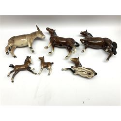 Beswick donkey and brown recumbent foal no. 915, Royal Doulton horse with raised left leg, and a further three brown horse figures (6)