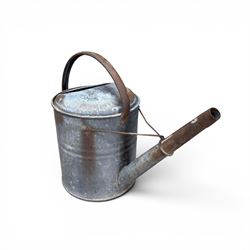 Eight early 20th century galvanised watering cans