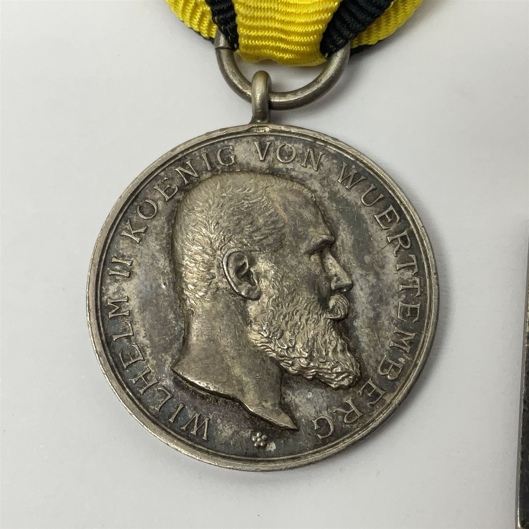 WWII German Iron Cross 2nd Class with ribbon; WWI German Wuerttemberg Medal with ribbon; and Day Badge for 1934 marked Reichsverband Pforzheim32 (3)