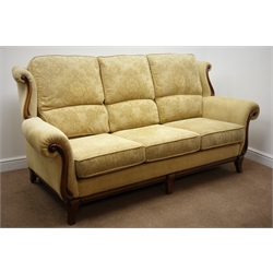  Three seat sofa upholstered in pale gold fabric with mahogany facias (W210cm) and matching two seater  