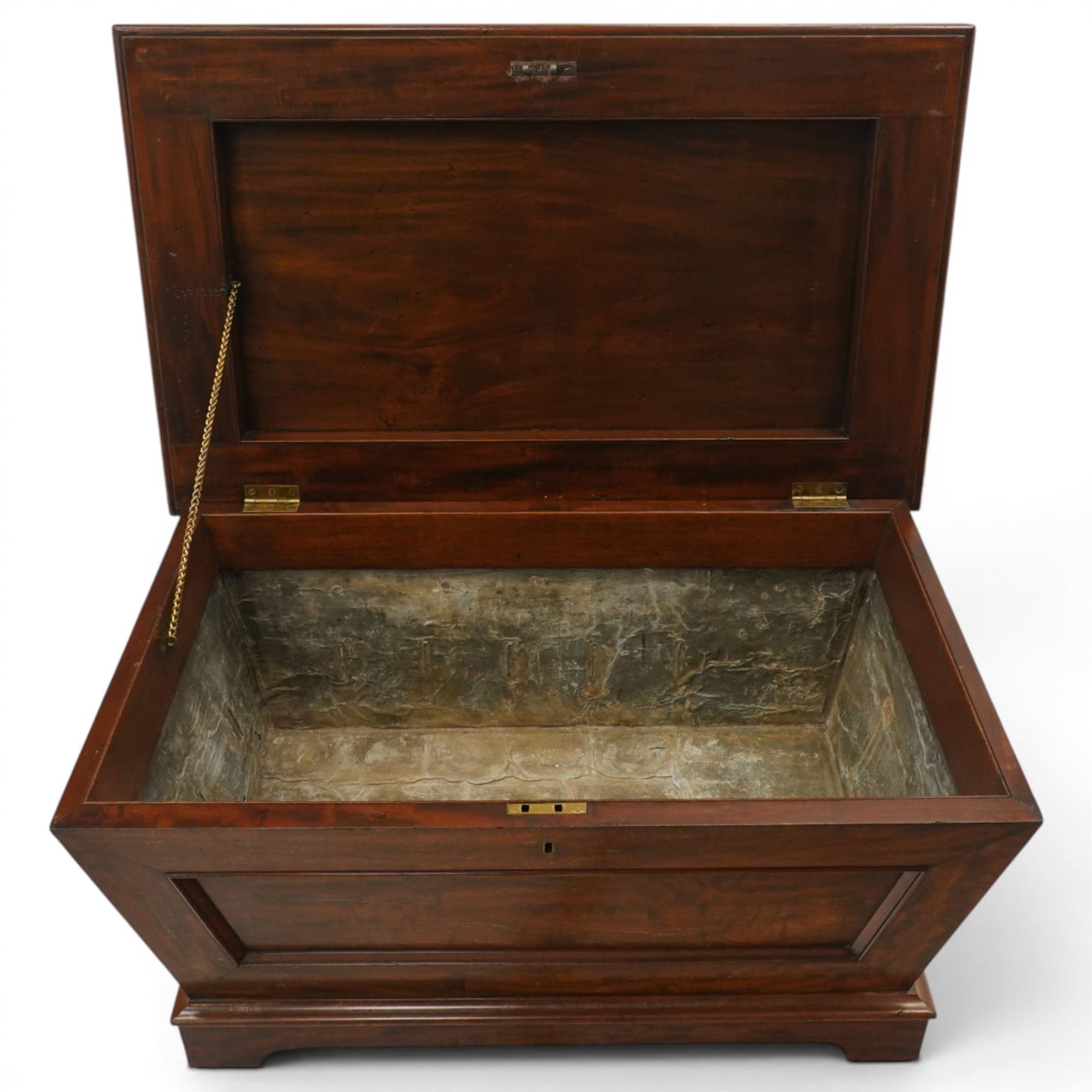Thomas & George Seddon (1815-1870) - Pair of mid-19th mahogany cellarettes of sarcophagus form, the hinged and panelled top surmounted by a gadrooned and lappet carved knop, surrounded by a moulded edge, enclosing a lead lined wine cooler interior to one, the other paper lined, lower moulded edge over bracket feet and castors