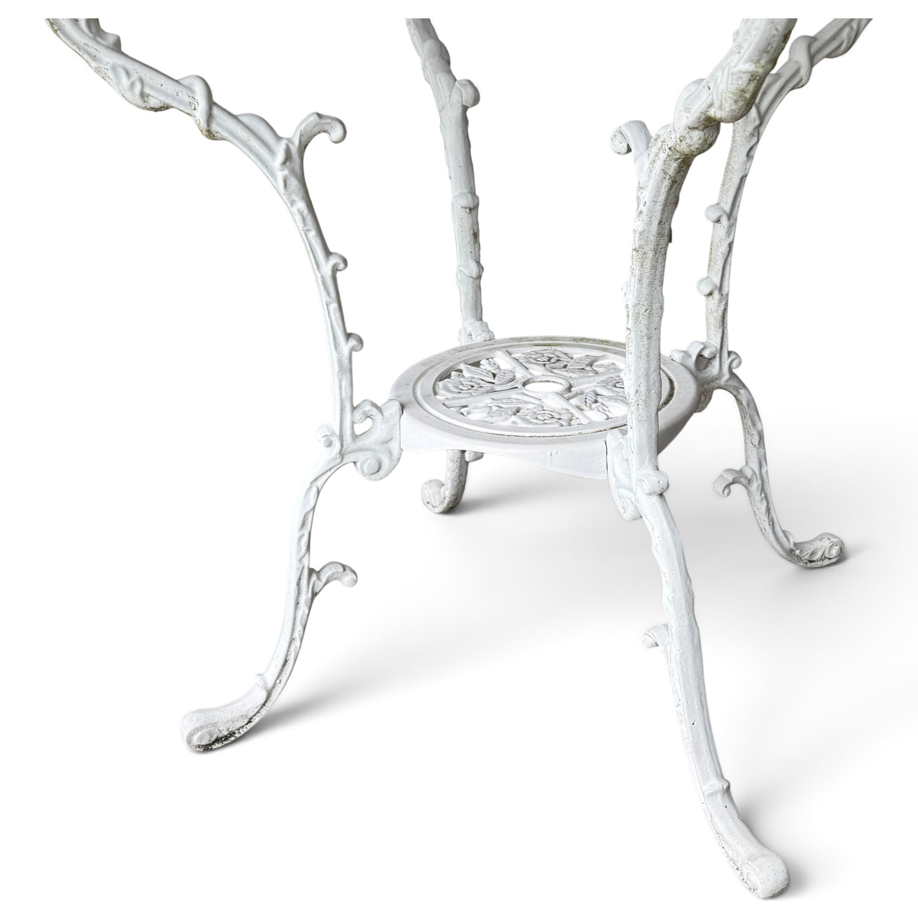 Regency design white-painted aluminium garden table, square pierced top with scrolling acanthus leaf decoration, splayed supports joined by pierced circular under-tier (W75cm H72cm), the chairs with scrolling and floral garland design backs over pierced foliate seats with cabriole supports (W48cm H90)