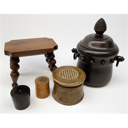 A treen tobacco jar, the body with twin ring handles, and domed cover with turned finial, H27.5cm, a small stool with turned legs, H17cm, and three jars, the largest with cane panel to top, H9.5cm. 