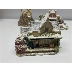 Five Lilliput Lanes, comprising Christmas at Woody Bay Station and Calling Home for Christmas both from the Illuminated collection, Castle of the Exiled Prince, Castle of The Ransomed King and Helvellyn, all with original boxes (5)
