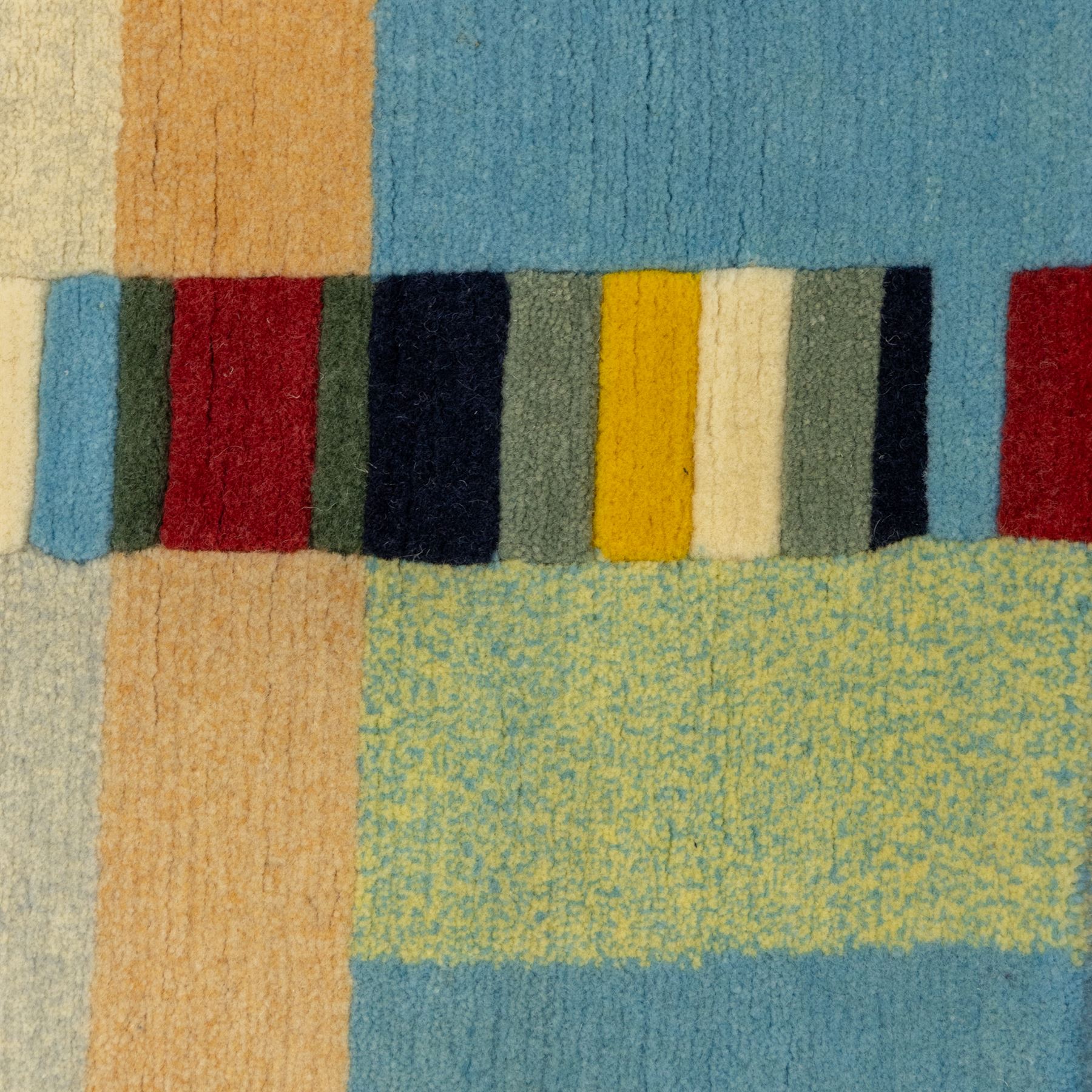 Rugs by Design - ‘Sand Bar’ Nepalese thick pile wool rug, with abstract horizontal bands in cream, blue, camel and dark brown tones, centred by a narrow multicoloured vertical stripe