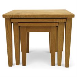Modern solid oak nest of three tables, each with straight-edged rectangular top and square legs