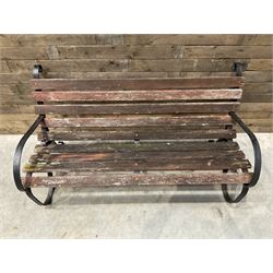 Early 20th century black painted wrought iron and wood slatted garden bench