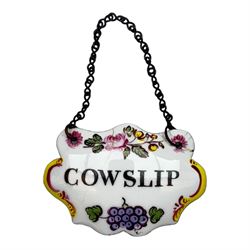 Seventeen mid 18th century and later enamel wine labels, one example of heart shaped form, the rest of cartouche and escutcheon form, various titles including Claret, Rum, Sloe Gin, Port, Whisky, Cowslip, Cherry-Brandy, etc., largest example W7cm 