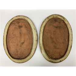 Pair of 19th century classical terracotta relief wall plaques depicting the goddess Hygeia and another goddess, seated holding an ewer, each of oval form, indistinctly signed, each stamped Ferreira verso, H42cm, W30cm